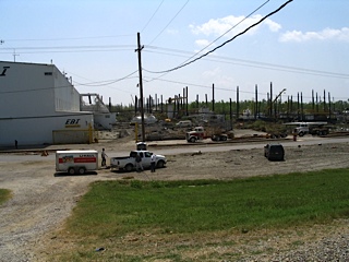 uHaul vehicle next to railroad and warehouse