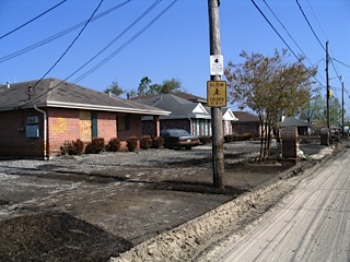 empty parking lot with Slow - Children road sign