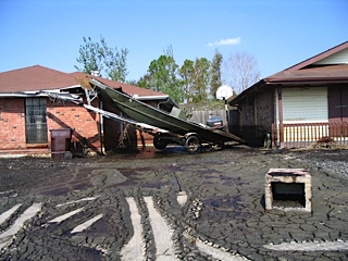 front yard of house with boat breaking into corner of house